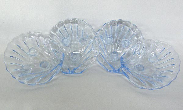 Blue Glass Nut Cups: 4 Blue Glass Nut Cups. Measure approx. 1''Hx3''W. Buyers Pay Actual Shipping and Handling Charges(see terms and conditions for more information).