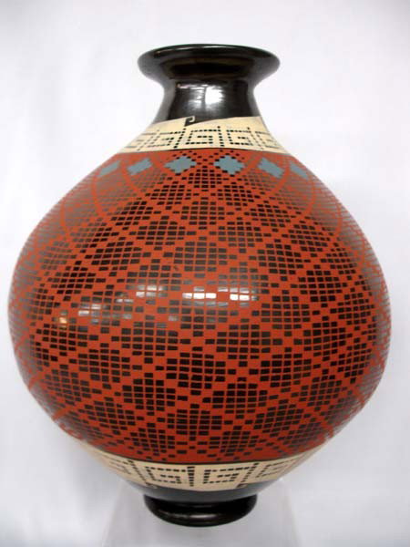 Mata Ortiz Large Eye Dazzler Jar by Benjamin Soto: Mata Ortiz Large Eye Dazzler Jar by Benjamin Soto. Measures 11''x9''. Buyers Pay Actual Shipping and Handling Charges(see terms and conditions for more information).