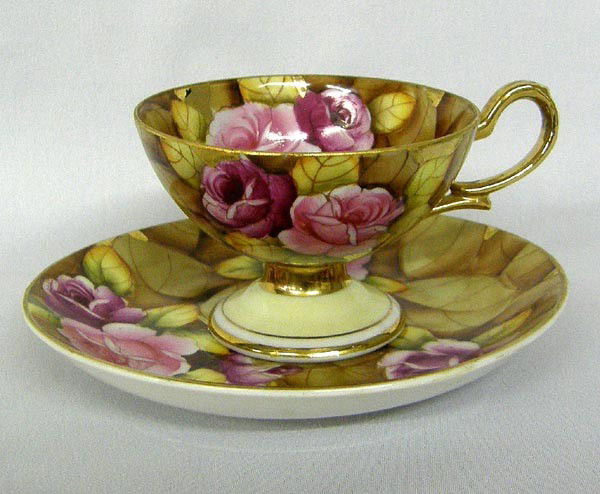 Lefton China Handpainted and Gilded Cup and Saucer: Lefton China Handpainted and Gilded Cup and Saucer. Saucer measures approx 4.75'' in diameter and cup is approx. 2''Hx2.75'' in diameter. Buyers Pay Actual Shipping and Handling Charges(see terms and
