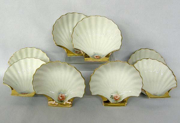 8 Porcelain Handpainted Gilded Nut Cups: 8 Porcelain Handpainted Gilded Nut Cups. Measure approx. 1.25''Hx3.75''W. Buyers Pay Actual Shipping and Handling Charges(see terms and conditions for more information).
