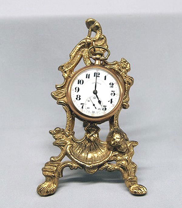 1919 Antique RR Illinois Gold Pocketwatch: 1919 Antique RR Illinois Gold Pocketwatch. Gold filled, 17 jewel, Ser. No. 3409748, double roller. Comes with Pocketwatch Display Stand. Watch is 2'' diameter. Buyers Pay Actual Shipping and Handling