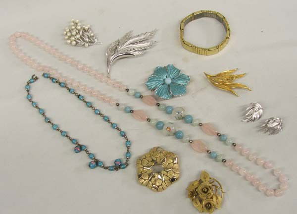 Estate Jewelry, some marked: Estate Jewelry, some marked. Majok Stainless Magnetic Bracelet, Pearl Trifari Pin, Tifari Silver Pin with matching earrings, Monet Gold Leaf Pin, Kramer Blue Flower Pin, Italian Miliflori Bead Necklac
