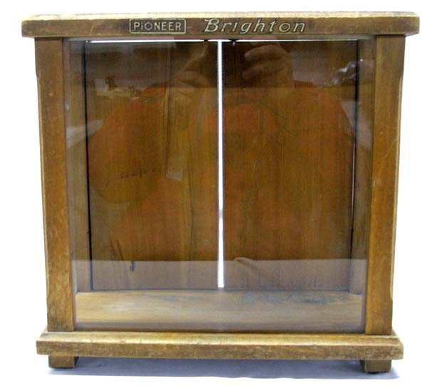 Brighton Wood and Glass Display Case: Brighton Wood and Glass Display Case. On front says ''Pioneer Brighton''. Measures approx. 14''H x 14 1/2''W x 6 1/2''D. Buyers Pay Actual Shipping and Handling Charges(see terms and conditions for mo