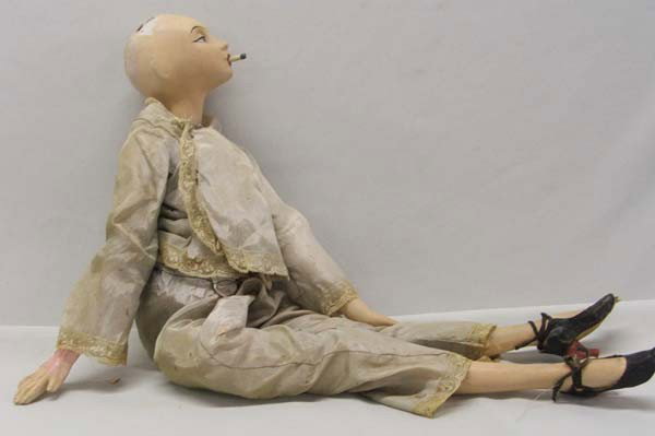 Antique Composition Doll Smoking A Cigarette: Antique Composition Doll Smoking A Cigarette. Looks like a French boudoir doll. Limbs are attached with string to head. Jointed hips, arms and legs. Jointed at knee and hip and lower and upper arms. D