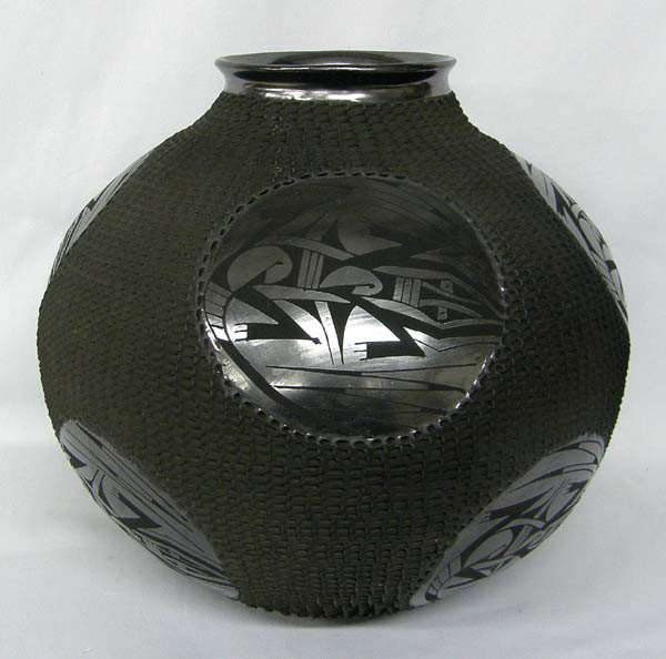 Mata Ortiz Black Textured Lizard Pot by Lucie Sote: Mata Ortiz Black Textured Lizard Pot by Lucie Sote. Measures approx. 12''Hx14''W. Buyers Pay Actual Shipping and Handling Charges(see terms and conditions for more information).