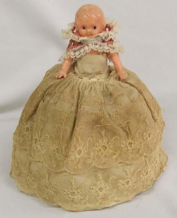 Antique Celluloid Pin Cushion Doll: Antique Celluloid Pin Cushion Doll. Measures approx. 6 3/4'' x 4 1/2'' round at bottom. Buyers Pay Actual Shipping and Handling Charges(see terms and conditions for more information).
