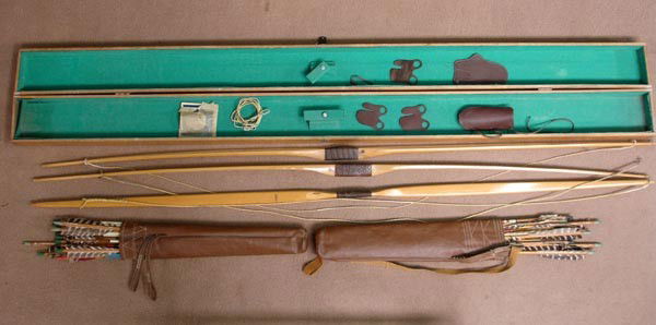3 Ben Pearson Bows w/Wood Case, 2 Quivers & Arrows: 3 Ben Pearson Bows w/Wood Case, 2 Quivers & Arrows. 1950s target bows by Ben Pearson, Pine Bluff, Arkansas. Case measures 5''x4.25''x70''. Buyers Pay Actual Shipping and Handling Charges(see terms and
