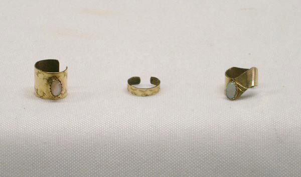 Southwestern Gold Overlay ear cuffs: Southwestern Gold Overlay ear cuffs. Set of 3. One has opal, other is pink mother of pearl and other cuff is stamped. Widest band measures 3/8'' wide. Stones measure 1/4'' long. Hallmarked Cf & FD. Bu