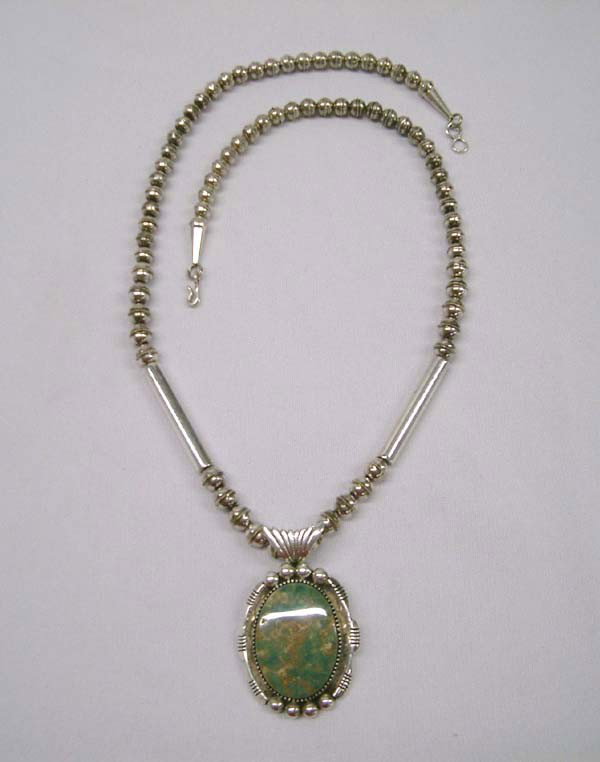 Native American Navajo Silver Necklace By Draper: Native American Navajo Sterling Silver Green Lone Mountain Nevada Turquoise Pendant Necklace by Draper. Hallmarked C. Draper and stamped sterling. 23.75'' end to end. Stone 1 3/8'' h by 1'' wide. Buye