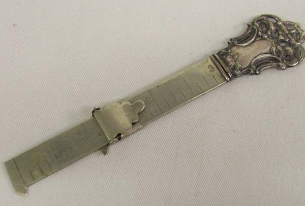 Antique Victorian Sterling Silver Hemming Ruler: Sterling Silver Hemming Ruler. The measuring portion is 3''. Over length is 4-5/8''. The handle is marked, ''sterling'' and an unreadable word above the word sterling. Buyers Pay Actual Shipping and H