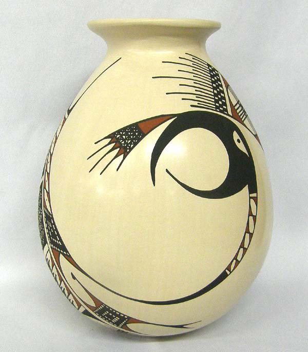 Mata Ortiz Polychrome Pot by Lucy Mora De Bugarini: Mata Ortiz Polychrome Pot by Lucy Mora De Bugarini. Measures approx. 9''Hx7''W. Buyers Pay Actual Shipping and Handling Charges(see terms and conditions for more information).