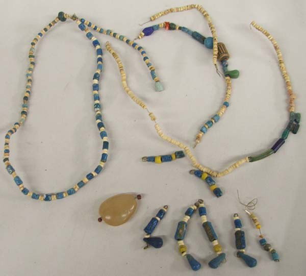 Egyptian Faience & Bone Beads Necklace: Egyptian Faience & Bone Beads Necklace. The necklace was strung on wire and has been broken in several places. The largest bead measures 1-1/8x1-7/8''. The pieces of strung beads add up to over 40'' i