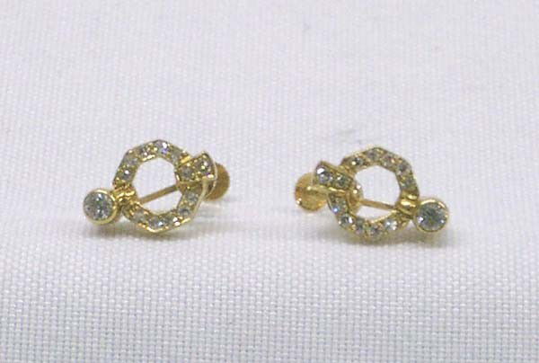 18Kt Diamond Earrings: 18Kt Diamond Screwback Earrings. Measures approx. .5'' x 3/8''. Buyers Pay Actual Shipping and Handling Charges(see terms and conditions for more information).