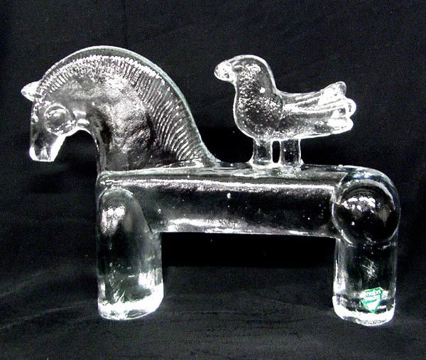 Orrefors Swedish Glass Horse with Bird: Orrefors Swedish Glass Horse with Bird. Flat on one side. Measures approx. 5''Hx8''Lx1.5''W. Buyers Pay Actual Shipping and Handling Charges(see terms and conditions for more information).
