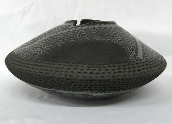 Mata Ortiz Black on Black Textured Pot by B. Soto: Mata Ortiz Black on Black Textured Pot by Benjamin Soto. Measures approx. 6''Hx12.5''W. Buyers Pay Actual Shipping and Handling Charges(see terms and conditions for more information).