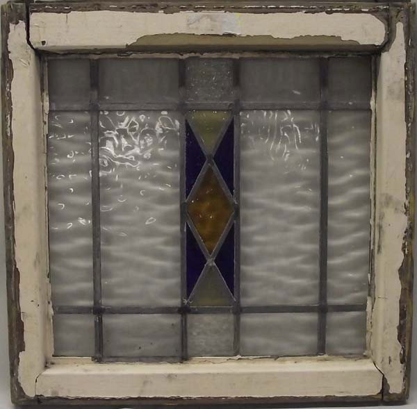 Antique Stain Glass Window: Antique Stain Glass Window in wooden pane. Blue and gold diamond pattern in center. Rippled glass surrounds the pattern. Buyers Pay Actual Shipping and Handling Charges(see terms and conditions for mo
