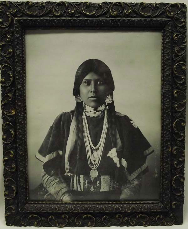 1800 Antique Framed Native American Maiden Photograph: Native American Maiden Photograph. 1875 to 1885 Native American woman wearing original attire, including a beaded belt, ermine hair tassels, hair bone choker, trade bead necklaces with peace medal pen