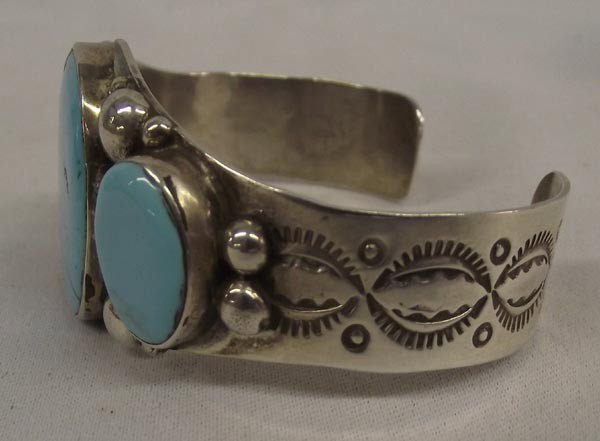 Navajo Silver Turquoise Bracelet by A&J Cleveland: Native American Navajo Sterling Silver Turquoise Bracelet by Albert and Janette Cleveland. Measurement in Inches - Inside Length(Including Opening) 6 1/2'' x 2 1/4'' Width. Buyers Pay Actual Shipping 