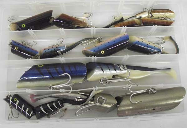 A.C. Fishing Plugs: Collection of A.C. Fishing Plugs. A.C. plug, dark rainbow, #1/0 hook, 7 1/2'', 2 oz. A.C. plug, black, w/ribs, #1/0 hook, 7 1/2'', 2 oz. A.C. plug, dark blue mackerel, #5/0 hook, 12'', 4 oz. In plasti