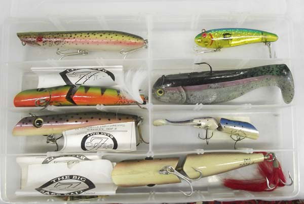 Gregg Silks' Hand Crafted Wood Lures Plus: Gregg Silks' Hand Crafted Wood Lures Plus. Largest (3) Z-Plug measures approx. 9 1/2'' long. Fred Arbogast wood lure, Bomber Mullet Floater, Pencil Popper. To name a few. All in plastic box. Buyers Pa
