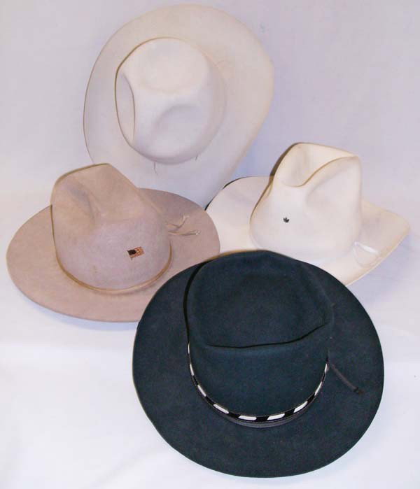 Vintage Cowboy Hats: 4 Vintage Cowboy Hats. Includes an ivory Bailey Beaver with no hatband (no size, probably a 6-3/4); a green Junior Stetson size 7; a cream yellow Stockman (probably a 7) and a light tan Donhoy Jr. (pr