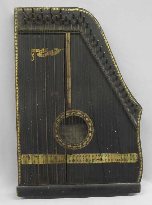 Antique Menzenhauer's Guitar Zither: Vintage Menzenhauer's Guitar Zither. Some cracks in the wood. Measures approx. 13'' x 19''. Buyers Pay Actual Shipping and Handling Charges(see terms and conditions for more information).