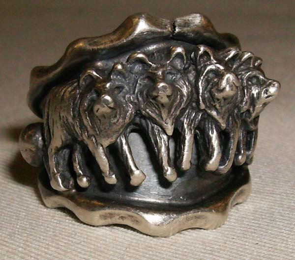 Sterling Silver Cast Wolf Ring: Silver Cast Wolf Ring, stamped .925 and hallmarked R.B. inside of an outline of a bear (possibly Running Bear Trading), size 6.75 and measures approx. 7/8''W x .5''W. Buyers Pay Actual Shipping and Ha