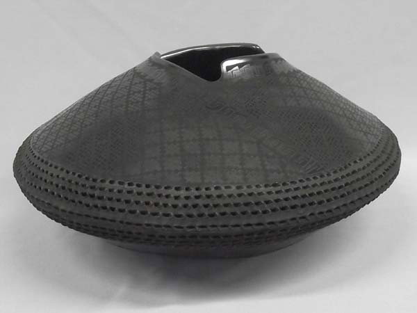 Mata Ortiz Pottery By Benjamin Soto: Mata Ortiz Pottery By Benjamin Soto. Black on Black eyedazzler, textured with cutaway rim. Measures approx. 6''H x 13''D. Buyers Pay Actual Shipping and Handling Charges(see terms and conditions for m