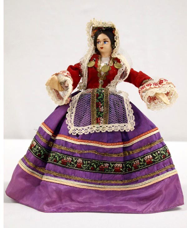 Vintage European Doll: Vintage European Doll. Composition and fabric with cloth costume. Missing one shoe. Measures 9''H. Buyers pay actual shipping and handling charges (see terms and conditions for more information.)