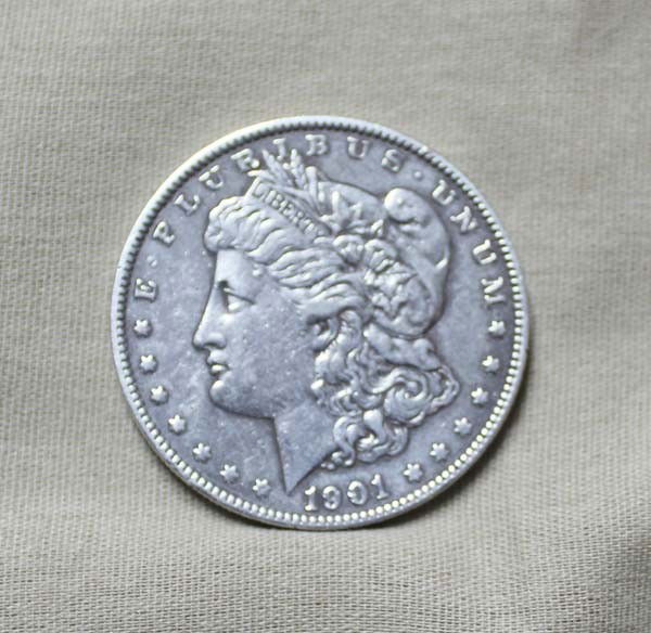 1901 Morgan Silver Dollar: 1901 Morgan Silver Dollar. Measures approx. 1 1/2''Diameter. Buyers Pay Actual Shipping and Handling Charges(see terms and conditions for more information).
