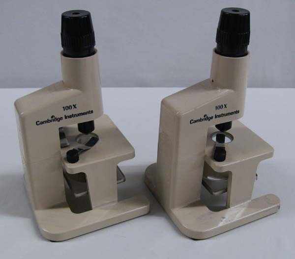 2 Cambridge Instruments Microscopes, 100x: 2 100X Cambridge Instruments Microscopes. Each measures 7.75''H. Buyers Pay Actual Shipping and Handling Charges(see terms and conditions for more information).