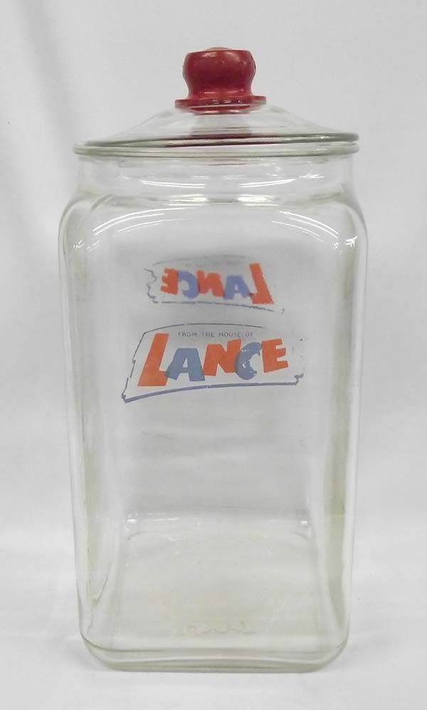Large Vintage Lance Cracker Jar: Large Vintage Lance Cracker Jar. Glass jar for country store. Logo painted on both sides. Measures approx. 14 1/2''H x 8 1/2'' x 6 1/2''. Chipping on lid. Buyers Pay Actual Shipping and Handling Charg