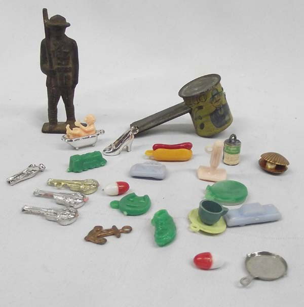 WWI Cast Iron Soldier Plus Toys: WWI Cast Iron Soldier Plus Toys. Kazoo, cracker jack and gum ball favors. Soldier measures approx. 3''H. Buyers Pay Actual Shipping and Handling Charges(see terms and conditions for more information).