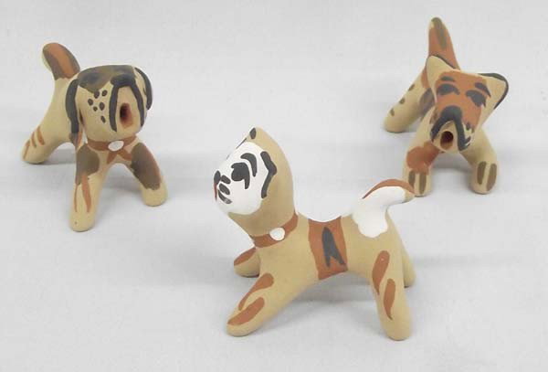 Jemez Folk Art Pottery Dogs & Cat - Bonnie Fragua: Native American Jemez Folk Art Dogs and Cat Pottery signed by noted artist, B.F. Fragua. Betty hand gathers her own clay and fires in the traditional way. Each pottery animal measures approx. 1.5 x 3 