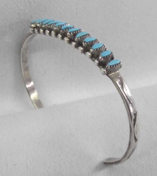 Zuni Silver Needlepoint Turquoise Bracelet By H LonJose: Native American Zuni Sterling Silver Needlepoint Turquoise Bracelet By H LonJose. Measurement in Inches - Inside Length(Including Opening) 6'' x 1/4'' Width, stones measure approx. 1/4''W. Buyers Pay