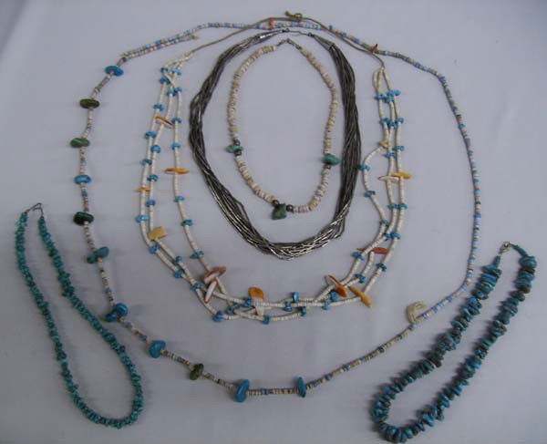 Collection of Six Vintage Pueblo Navajo Necklaces: Six Native American Navajo necklaces. One in the style of liquid silver, 22'' long; Two turquoise nugget chokers; One 3 strand heishi shell and turquoise measuring 34''; One 48'' heishi and turquoise