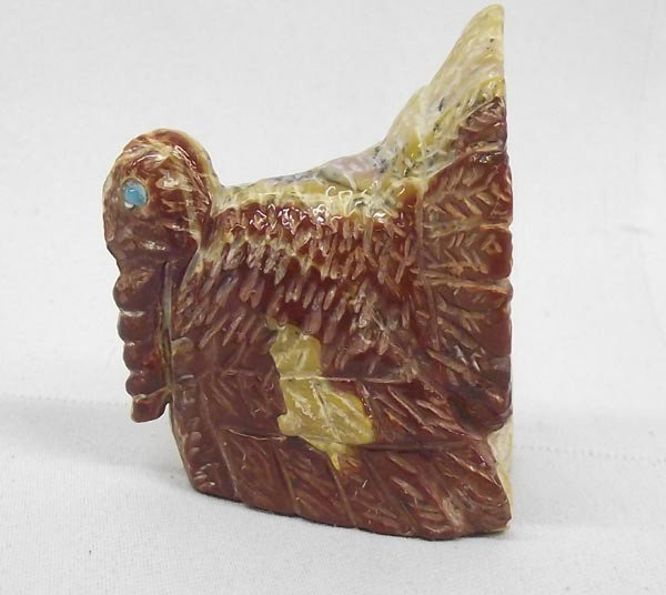 Zuni Turkey Fetish By Mike Tuseo: Native American Zuni Turkey Fetish By Mike Tuseo. Measures approx. 2''H x 1 3/4''D x 3/4''W. Chip on tip of tail feathers. Turquoise eyes. Buyers Pay Actual Shipping and Handling Charges(see terms and