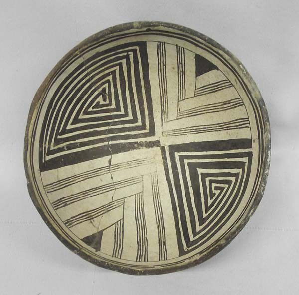 Prehistoric Mimbres Eye Dazzler Pottery: Prehistoric Mimbres Eye Dazzler Pottery. Measures approx. 2 1/2''H x 6''W. Bowl has been glued. This bowl has a puzzle maze eye dazzler pattern. IN Compliance with all State and Federal regulations. B
