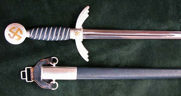 WWII 1st Model Luftwaffe Officer Sword & Scabbard: A fine original 1st Model Luftwaffe Officers's Sword with scabbard. Overall condition is near mint. This WW2 German 3rd Reich military edged weapon is a ''bring back'' in 1945 from occupied Berlin, Ge