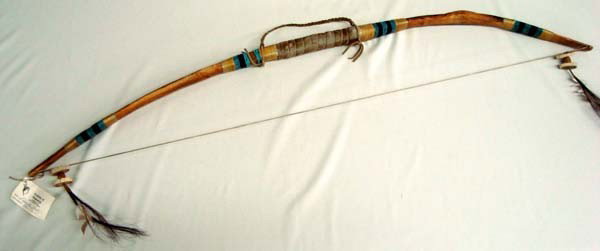 Native American Hand Beaded Bow with COA: Native American Beaded Bow. Bead work, leather, horse hair and bone decorate the wood bow. Measures approx. 46''L. Buyers Pay Actual Shipping and Handling Charges(see terms and conditions for more inf