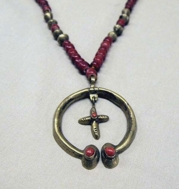 19th Century Red Heart Trade Bead Brass Necklace: Antique Red Heart Trade Bead Brass Necklace, vintage Naja. Antique brass red heart trade bead naja necklace strung on leather. Necklace measures end to end approx. 29'', naja measures approx. 2'' x 2.