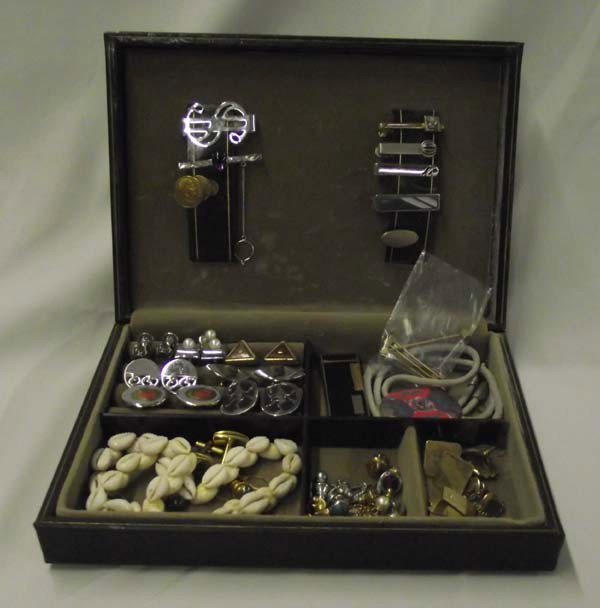 Collection Of Vintage Cufflinks: Collection Of Vintage Cufflinks. Collection includes cufflinks, tie tacks, cowry shell choker from Tahiti, bolo tie, money clip, tie bars, Calibri butane lighter. One pearl cufflink and tie tack set, 