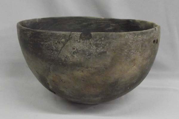 Prehistoric Large Mimbres Utilitarian Bowl: Prehistoric Native American Large Mimbres Utilitarian Bowl. Bowl has four small pieces missing. Also, there are two drill holes one side of the bowl. Bowl has been glued. No overpaint and no paste. Bo