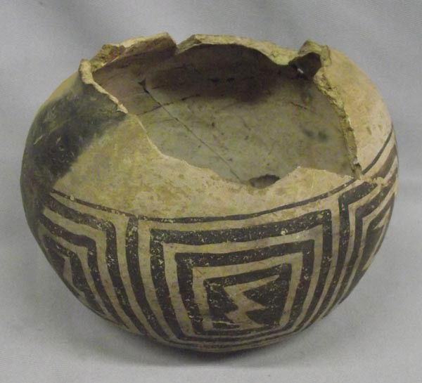 Prehistoric Mimbres Black on White Bowl: Prehistoric Native American Mimbres Black on White Bowl. Has been glued and is missing large rim and upper quarter pieces. Black on white thunder maze designs all around the bowl. Measures 4.5''x4''.