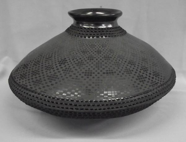 Mata Ortiz Black Textured Jar-Benjamin Soto: Mata Ortiz Black Textured Jar-Benjamin Soto. Eye dazzler with textured design on middle. Signed on bottom. Measures 7''Hx12.5''D. Buyers Pay Actual Shipping and Handling Charges(see terms and conditio
