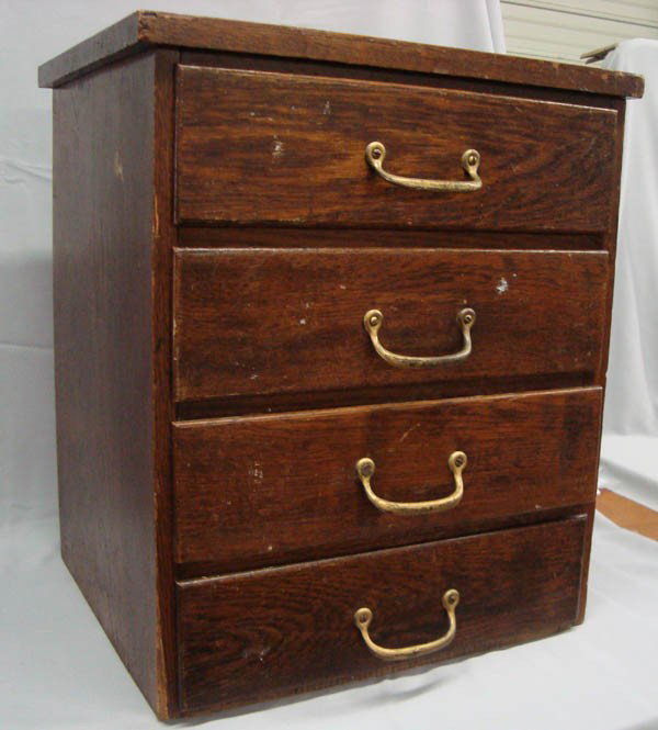 Antique Small Oak 4 Drawer File Cabinet: Small Oak 4 Drawer File Cabinet, for file folders. Measures 18'' high x 15 1/2'' wide and 13'' deep. Each vintage drawer has an insert for file folders. On reverse side of drawers is a book like view 