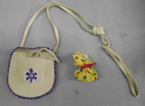 Native American Leather Medicine Pouch: Native American Leather Medicine Pouch. Turtle beaded on front of pouch. Herbs wrapped in cloth inside. Pouch measures 3''x2.75''. Buyers Pay Actual Shipping and Handling Charges(see terms and conditi
