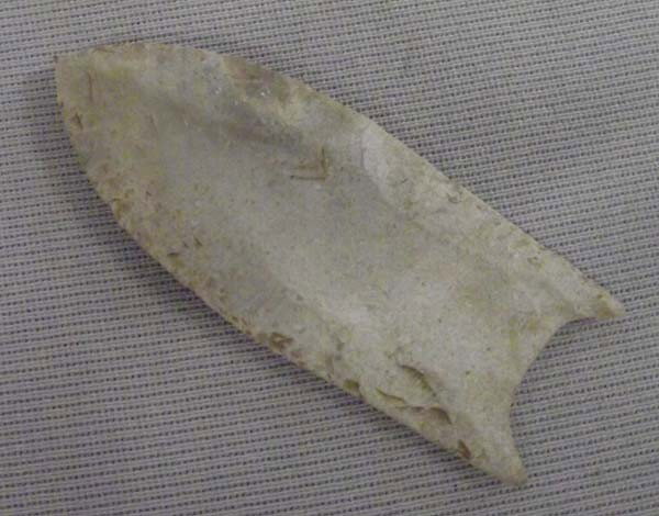 Classic Stone Arrowhead: Classic Stone Arrowhead. Age and origin unknown. Measures approx. 2 1/2''L. Buyers Pay Actual Shipping and Handling Charges(see terms and conditions for more information).