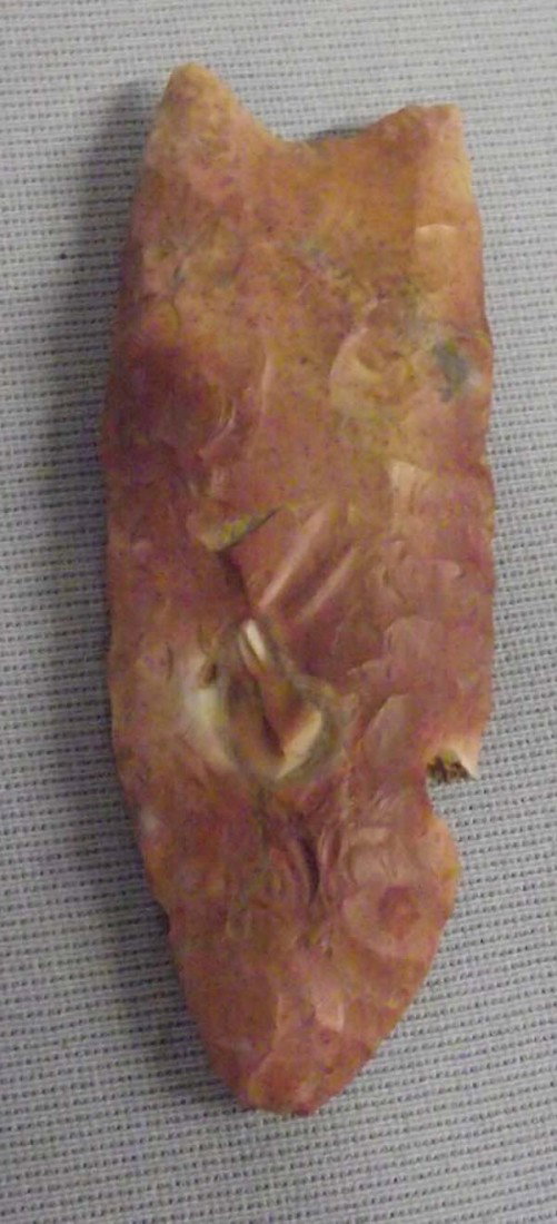 Classic Stone Arrowhead: Classic Stone Arrowhead. Age and origin unknown. Chip. Measures approx. 3''L. Buyers Pay Actual Shipping and Handling Charges(see terms and conditions for more information).