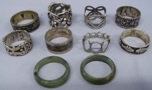 Vintage Lot of Silver Band Rings: Vintage Lot of Silver Band Rings. Sizes range from 7.5-10, mostly Mexican silver from the 1960's. Includes one small band inlaid with abalone, 2 Chinese jade bands, one band w/Mayan symbols, one sterl
